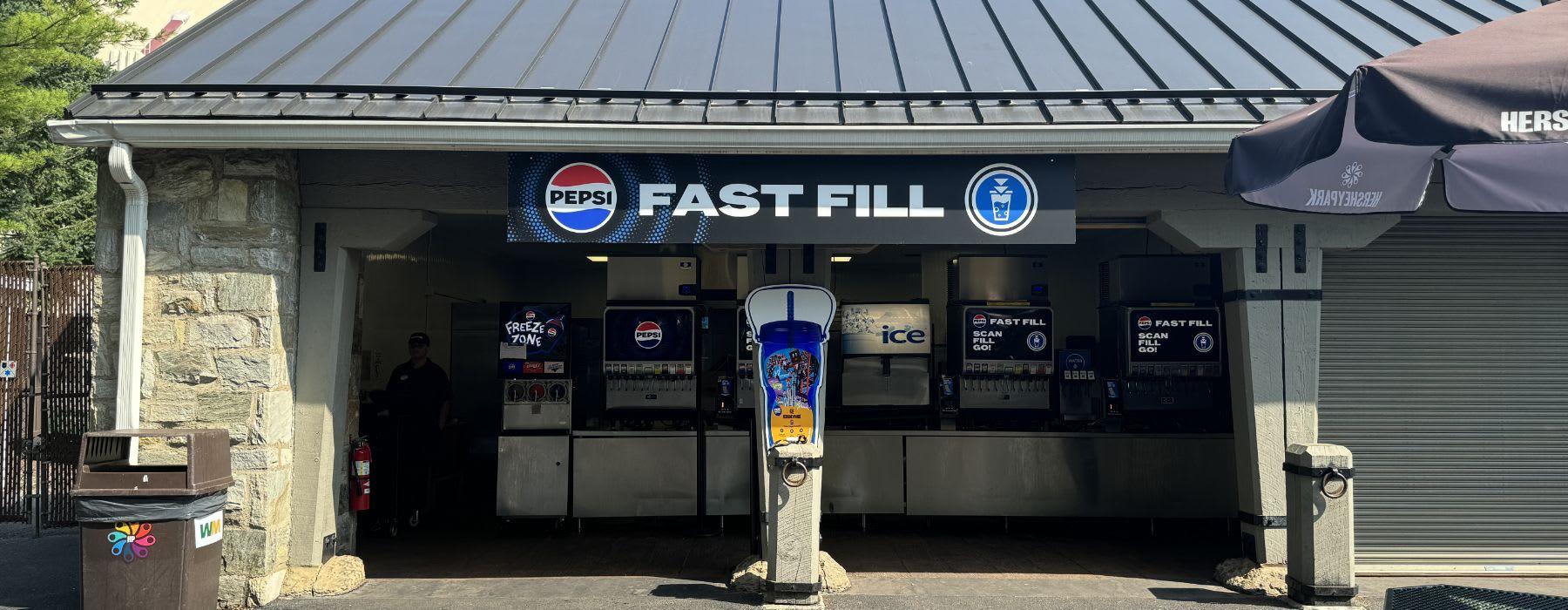 Inside of building with Pepsi machines and queue line