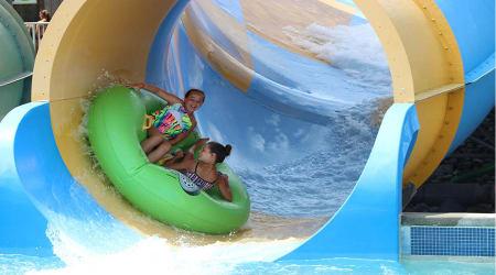 girls riding Coastline Plunge Whirlwind water attraction at Hersheypark