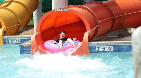 boy riding coastline plunge hydro water slide